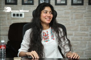 Actress Sai Pallavi in white top and blue jeans