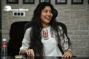 Actress Sai Pallavi in white top and blue jeans