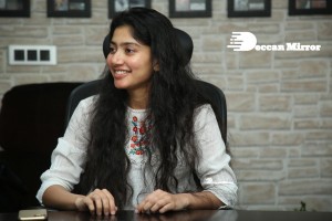 Actress Sai Pallavi in white top and blue jeans