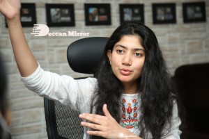Actress Sai Pallavi in white top and blue jeans