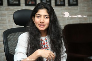 Actress Sai Pallavi in white top and blue jeans