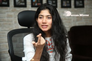 Actress Sai Pallavi in white top and blue jeans