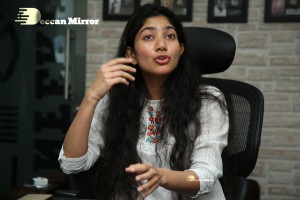 Actress Sai Pallavi in white top and blue jeans