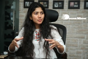 Actress Sai Pallavi in white top and blue jeans