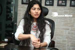 Actress Sai Pallavi in white top and blue jeans