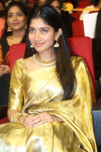 Actress Sai Pallavi in a yellow golden saree while attending a movie event