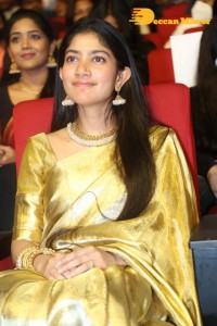 Actress Sai Pallavi in a yellow golden saree while attending a movie event