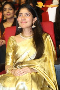 Actress Sai Pallavi in a yellow golden saree while attending a movie event