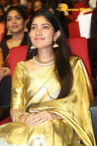 Actress Sai Pallavi in a yellow golden saree while attending a movie event
