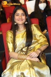 Actress Sai Pallavi in a yellow golden saree while attending a movie event