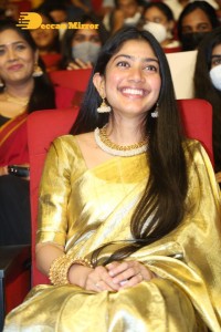 Actress Sai Pallavi in a yellow golden saree while attending a movie event