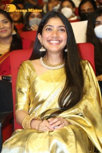 Actress Sai Pallavi in a yellow golden saree while attending a movie event