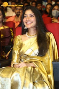 Actress Sai Pallavi in a yellow golden saree while attending a movie event