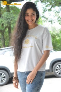 Telugu and Tamil Actress Sai Pallavi photoshoot in a white t-shirt and blue denim jeans
