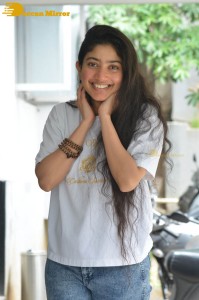 Telugu and Tamil Actress Sai Pallavi photoshoot in a white t-shirt and blue denim jeans