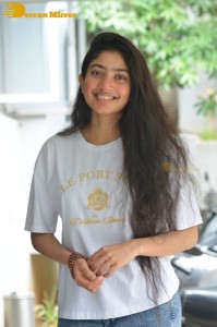 Telugu and Tamil Actress Sai Pallavi photoshoot in a white t-shirt and blue denim jeans