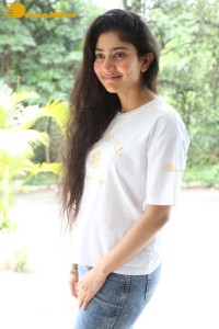 Telugu and Tamil Actress Sai Pallavi photoshoot in a white t-shirt and blue denim jeans