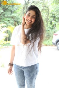Telugu and Tamil Actress Sai Pallavi photoshoot in a white t-shirt and blue denim jeans