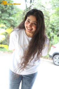 Telugu and Tamil Actress Sai Pallavi photoshoot in a white t-shirt and blue denim jeans