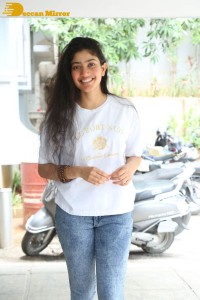 Telugu and Tamil Actress Sai Pallavi photoshoot in a white t-shirt and blue denim jeans