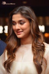 Actress Saiee Manjrekar dressed in white while attending a movie event