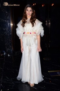 Actress Saiee Manjrekar dressed in white while attending a movie event