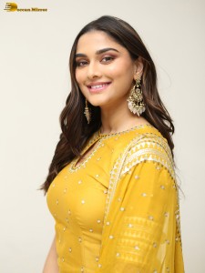 actress Saiee Manjrekar sexy looks in a yellow salwar dress