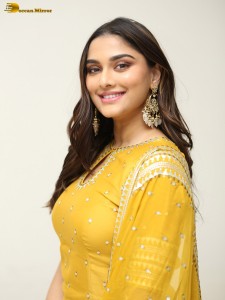 actress Saiee Manjrekar sexy looks in a yellow salwar dress