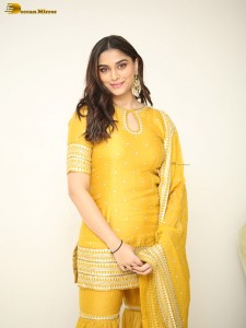 actress Saiee Manjrekar sexy looks in a yellow salwar dress