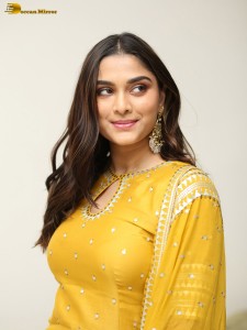 actress Saiee Manjrekar sexy looks in a yellow salwar dress