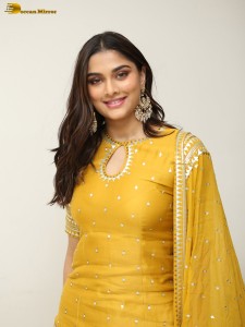 actress Saiee Manjrekar sexy looks in a yellow salwar dress