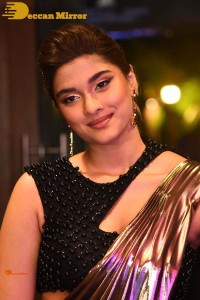 Saiee Manjrekar attending Ghani movie function in a brown shiny saree