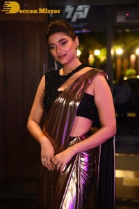 Saiee Manjrekar attending Ghani movie function in a brown shiny saree
