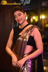 Saiee Manjrekar attending Ghani movie function in a brown shiny saree