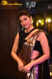 Saiee Manjrekar attending Ghani movie function in a brown shiny saree