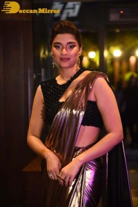 Saiee Manjrekar attending Ghani movie function in a brown shiny saree