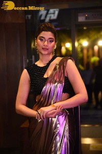 Saiee Manjrekar attending Ghani movie function in a brown shiny saree