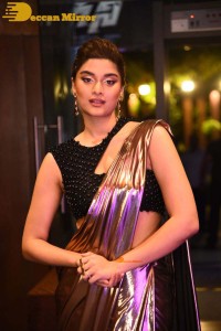 Saiee Manjrekar attending Ghani movie function in a brown shiny saree