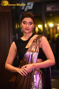 Saiee Manjrekar attending Ghani movie function in a brown shiny saree