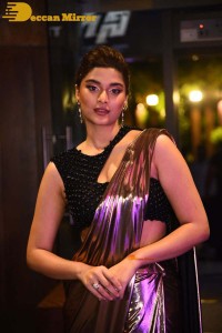 Saiee Manjrekar attending Ghani movie function in a brown shiny saree