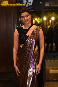 Saiee Manjrekar attending Ghani movie function in a brown shiny saree