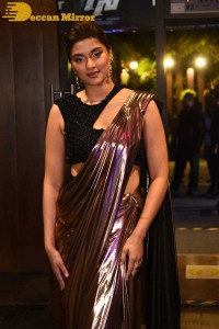 Saiee Manjrekar attending Ghani movie function in a brown shiny saree