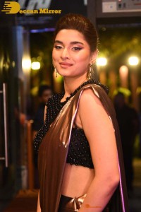 Saiee Manjrekar attending Ghani movie function in a brown shiny saree