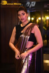 Saiee Manjrekar attending Ghani movie function in a brown shiny saree