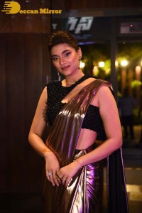 Saiee Manjrekar attending Ghani movie function in a brown shiny saree