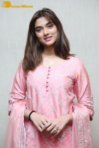 Actress Saiee Manjrekar in a pink dress
