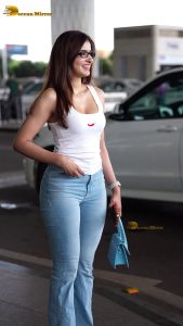 actress sakshi malik sexy in a white top and denim jeans