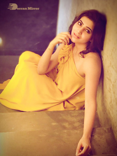 Telugu Actress Samantha dressed in yellow posing for a picture