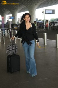 actress Sangeeta Bijlani gorgeous in a black top and blue jeans at mumbai airport