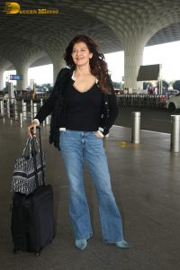 actress Sangeeta Bijlani gorgeous in a black top and blue jeans at mumbai airport